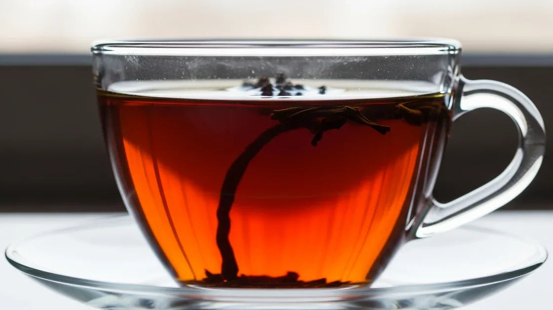 Close-up of dry black tea leaves showing deep amber oxidation